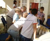 Mihai Strambu in mijlocul copiilor si langa tabla de sah si inca o problema rezolvata ... La multi ani de la SDV ...