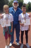 Campionii nationali Mario Dobrescu si Alisia Paruba de la CS Atletic Adjud si antrenorul Geo Catrinescu...