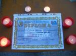 Diplomele Memorialului inconjurate de lumanari...